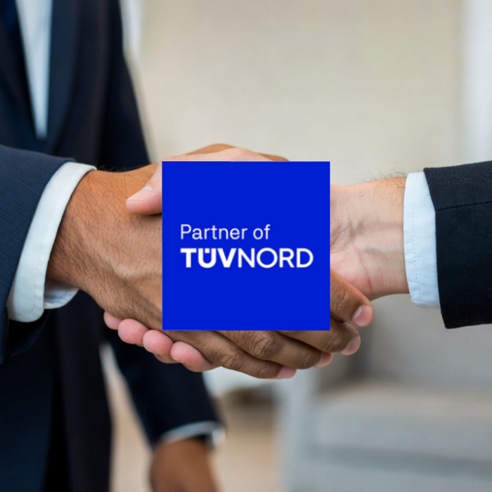 Handdruk met het logo Partner of TÜV NORD als symbool voor samenwerking.